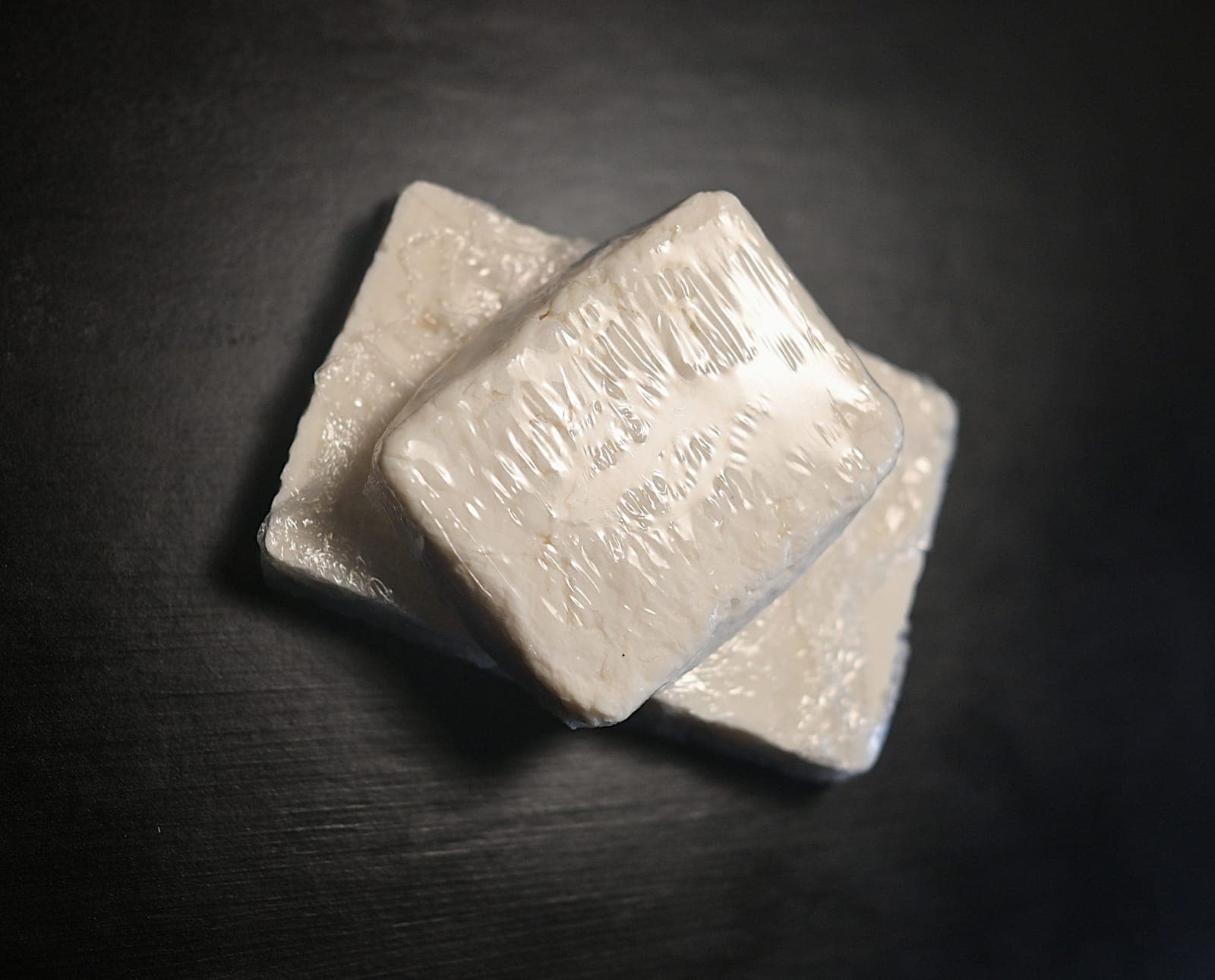 Photo: a finished bar being individually wrapped, clean and sealed, ready for distribution.